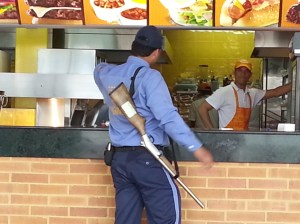 This private security guard is protecting the burgers at El Corral - or more accurately, all the cars parked in the garage below.