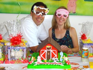 Happy parental units pose with the beautiful and remarkably delicious cake.